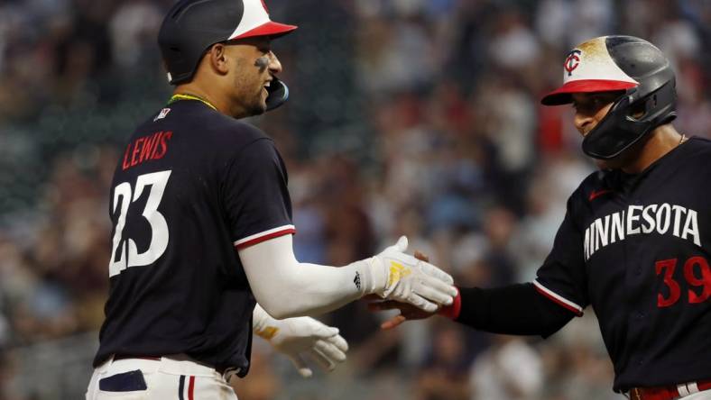 Jun 1, 2023; Minneapolis, Minnesota, USA; Minnesota Twins third baseman Royce Lewis celebrates his two-run home run against the Cleveland Guardians with designated hitter Donovan Solano (39) in the eighth inning at Target Field. Mandatory Credit: Bruce Kluckhohn-USA TODAY Sports