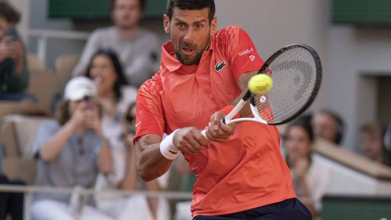 Jun 2, 2023; Paris,France; Novak Djokovic (SRB) returns a shot during his match against Alejandro Davidovich Fokina (ESP) on day six at Stade Roland-Garros. Mandatory Credit: Susan Mullane-USA TODAY Sports