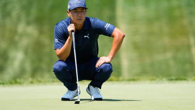 June 2, 2023; Dublin, Ohio, USA;  Justin Suh lines up a putt on the eighth green during the second round of the Memorial Tournament at Muirfield Village Golf Club.