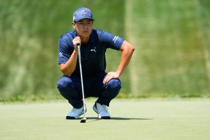 June 2, 2023; Dublin, Ohio, USA;  Justin Suh lines up a putt on the eighth green during the second round of the Memorial Tournament at Muirfield Village Golf Club.