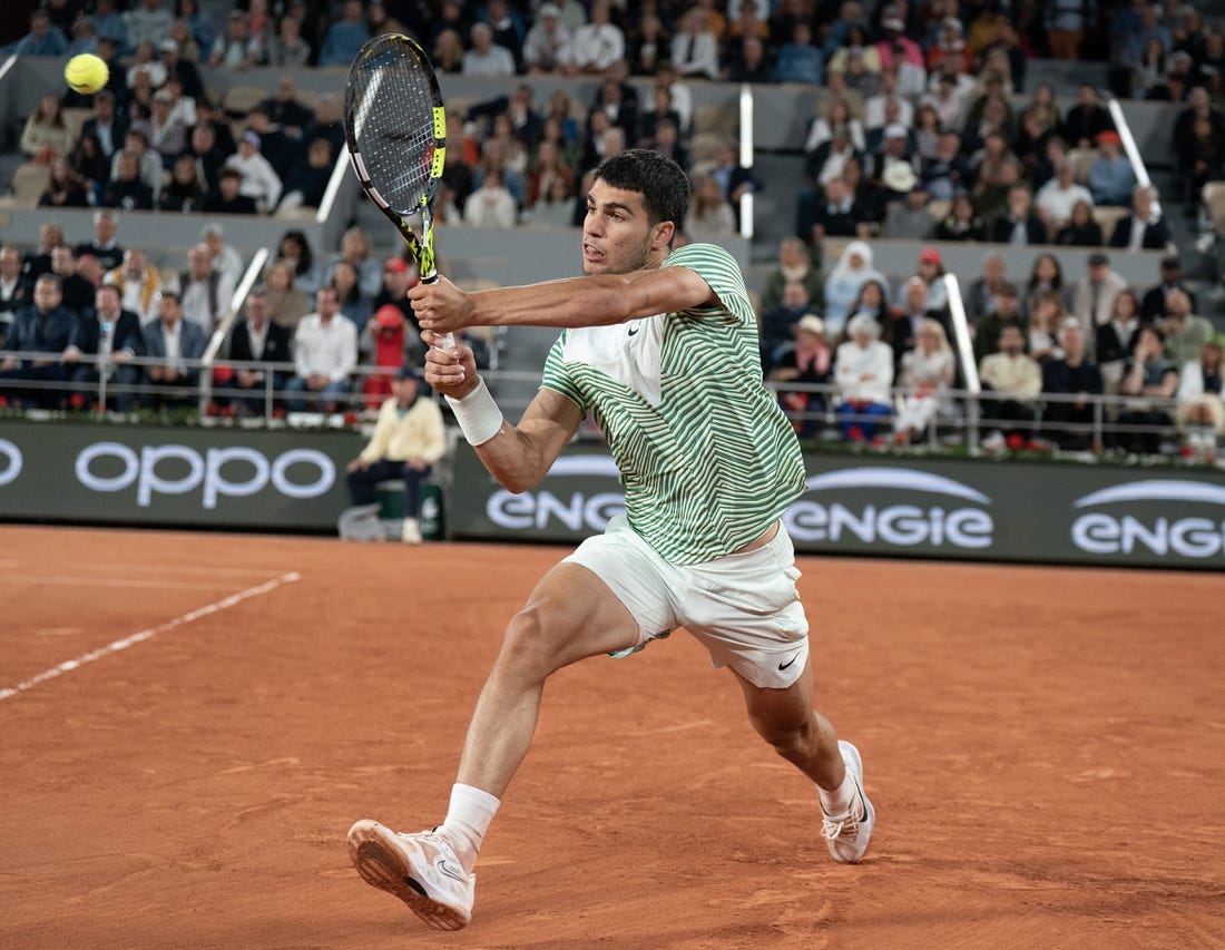 Jun 2, 2023; Paris,France; Carlos Alcaraz (ESP) returns a shot during his match against Denis Shapovalov (CAN) on day six at Stade Roland-Garros. Mandatory Credit: Susan Mullane-USA TODAY Sports