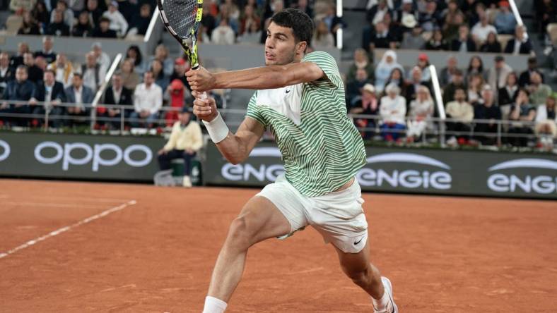 Jun 2, 2023; Paris,France; Carlos Alcaraz (ESP) returns a shot during his match against Denis Shapovalov (CAN) on day six at Stade Roland-Garros. Mandatory Credit: Susan Mullane-USA TODAY Sports