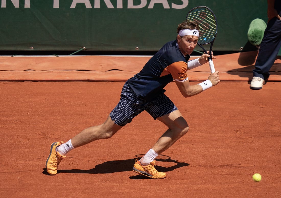 Jun 3, 2023; Paris,France; Casper Ruud (NOR) returns a shot during his match against Zhizhen Zhang (CHN) on day seven at Stade Roland-Garros. Mandatory Credit: Susan Mullane-USA TODAY Sports