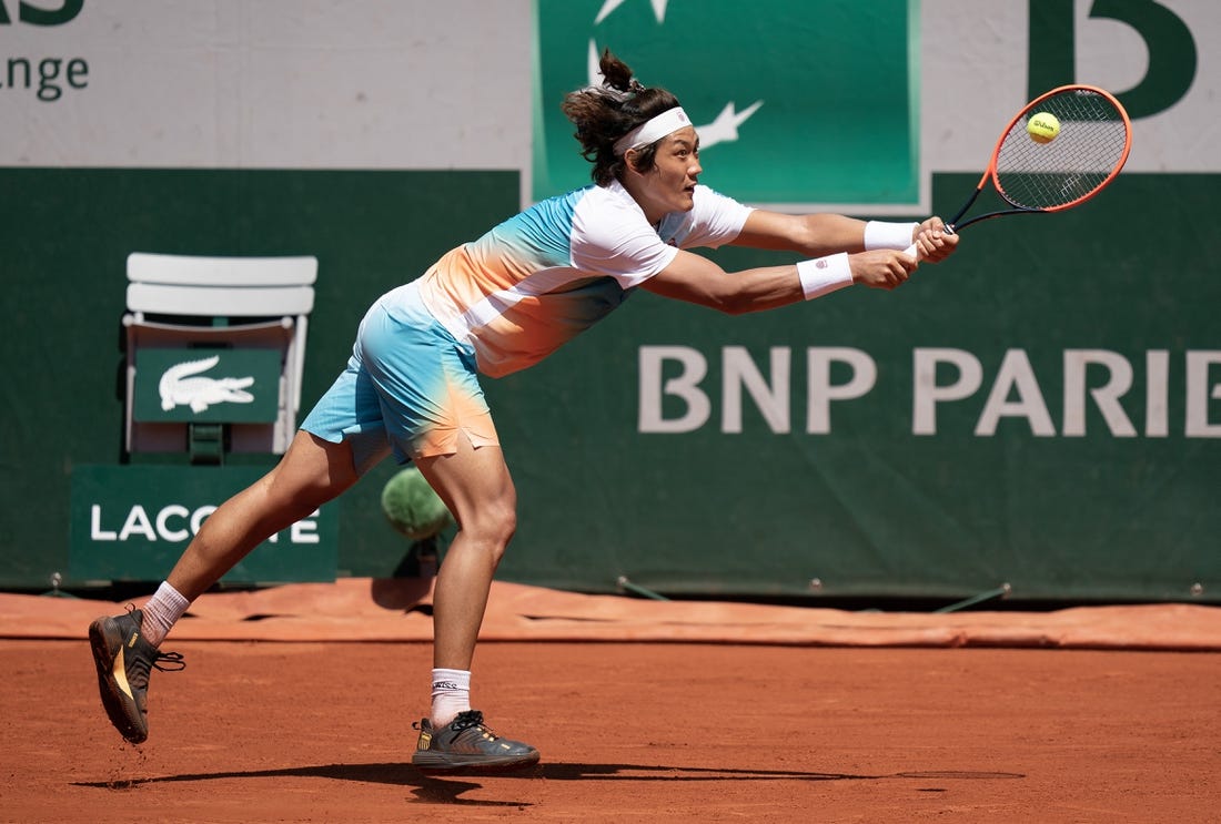 Jun 3, 2023; Paris,France; Zhizhen Zhang (CHN) returns a shot during his match against Casper Ruud (NOR) on day seven at Stade Roland-Garros. Mandatory Credit: Susan Mullane-USA TODAY Sports