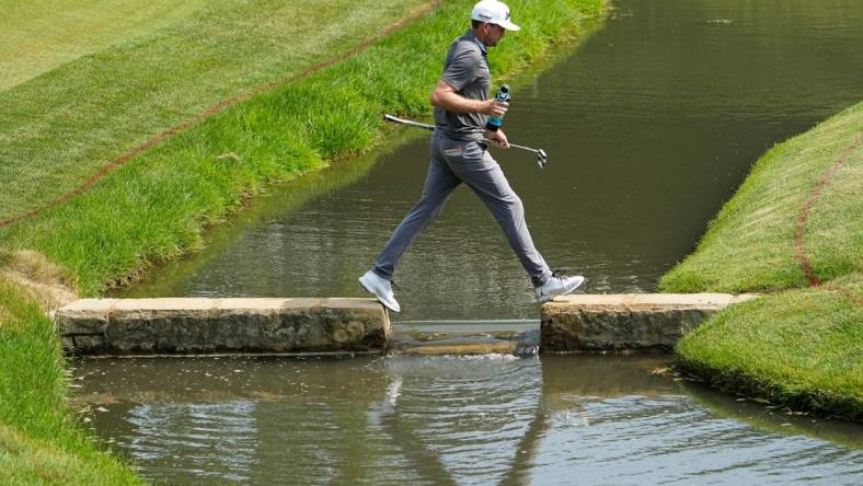 June 3, 2023; Dublin, Ohio, USA;  Keegan Bradley crosses the creek as he walks to the 14th green during the third round of the Memorial Tournament at Muirfield Village Golf Club.