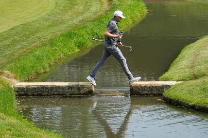 June 3, 2023; Dublin, Ohio, USA;  Keegan Bradley crosses the creek as he walks to the 14th green during the third round of the Memorial Tournament at Muirfield Village Golf Club.