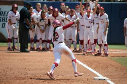 Oklahoma's Tiare Jennings (23) celebrates after hitting a three-run home run in the second inning of a softball game between the University of Oklahoma Sooners (OU) and Tennessee in the Women's College World Series at USA Softball Hall of Fame Stadium in Oklahoma City, Saturday, June 3, 2023.
