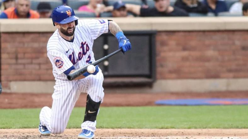 Jun 3, 2023; New York City, New York, USA;  New York Mets catcher Tomas Nido (3) attempts a sacrifice bunt in the fifth inning against the Toronto Blue Jays at Citi Field. Mandatory Credit: Wendell Cruz-USA TODAY Sports