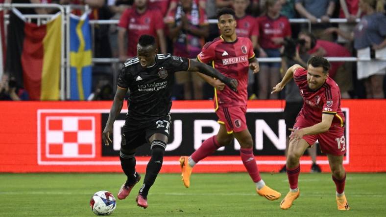 Jun 3, 2023; St. Louis, Missouri, USA; Houston Dynamo midfielder Luis Caicedo (27) runs with the ball during the first half at CITYPARK. Mandatory Credit: Scott Rovak-USA TODAY Sports