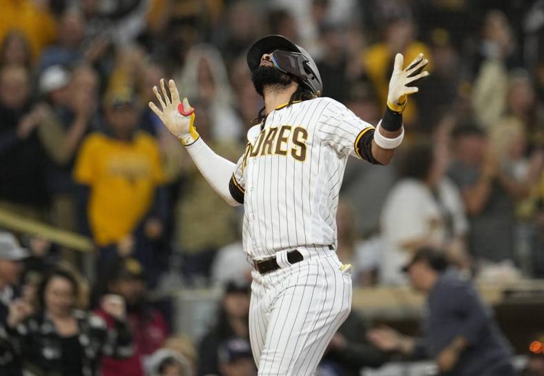 Jun 3, 2023; San Diego, California, USA;  San Diego Padres right fielder Fernando Tatis Jr. (23) reacts to his home run against the Chicago Cubs during the third inning at Petco Park. Mandatory Credit: Ray Acevedo-USA TODAY Sports