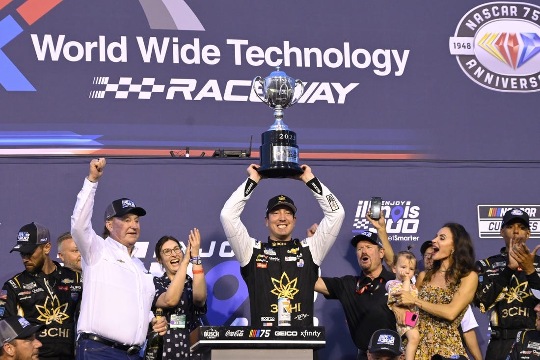 Jun 4, 2023; Madison, Illinois, USA; NASCAR Cup Series driver Kyle Busch (8) and his team pose for a photo after winning the Enjoy Illinois 300 at World Wide Technology Raceway. Mandatory Credit: Joe Puetz-USA TODAY Sports