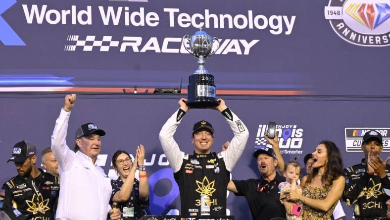 Jun 4, 2023; Madison, Illinois, USA; NASCAR Cup Series driver Kyle Busch (8) and his team pose for a photo after winning the Enjoy Illinois 300 at World Wide Technology Raceway. Mandatory Credit: Joe Puetz-USA TODAY Sports