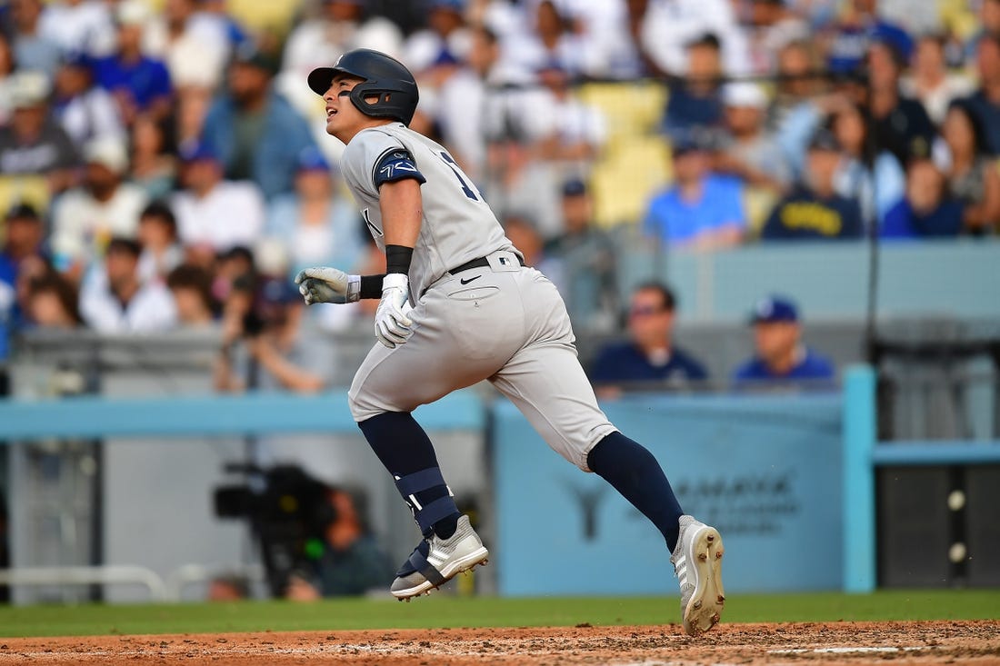 Jun 4, 2023; Los Angeles, California, USA; New York Yankees shortstop Anthony Volpe (11) hits a two run home run against the Los Angeles Dodgers during the ninth inning at Dodger Stadium. Mandatory Credit: Gary A. Vasquez-USA TODAY Sports