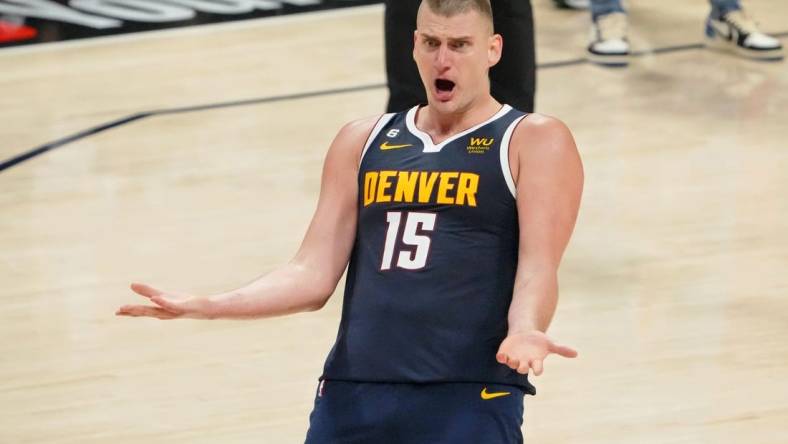 Jun 4, 2023; Denver, CO, USA; Denver Nuggets center Nikola Jokic (15) reacts after a play against the Miami Heat during the third quarter in game two of the 2023 NBA Finals at Ball Arena. Mandatory Credit: Kyle Terada-USA TODAY Sports