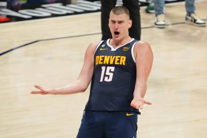 Jun 4, 2023; Denver, CO, USA; Denver Nuggets center Nikola Jokic (15) reacts after a play against the Miami Heat during the third quarter in game two of the 2023 NBA Finals at Ball Arena. Mandatory Credit: Kyle Terada-USA TODAY Sports