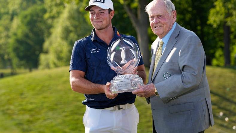 June 4, 2023; Dublin, Ohio, USA;  Viktor Hovland stands with Jack Nicklaus and the trophy after winning in a playoff over Denny McCarthy during the final round of the Memorial Tournament at Muirfield Village Golf Club.