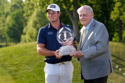 June 4, 2023; Dublin, Ohio, USA;  Viktor Hovland stands with Jack Nicklaus and the trophy after winning in a playoff over Denny McCarthy during the final round of the Memorial Tournament at Muirfield Village Golf Club.