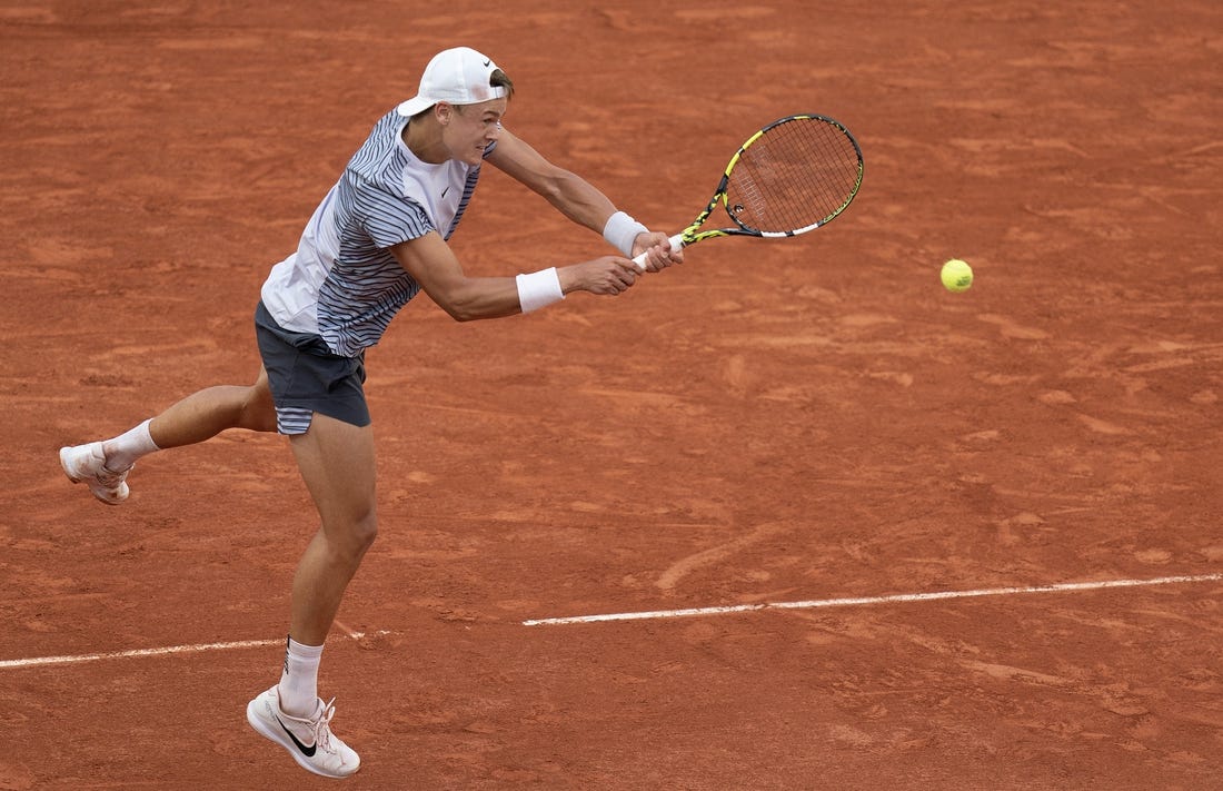 Jun 5 2023; Paris, France; Holger Rune (DEN) returns a shot against Francisco Cerundolo (ARG) on day nine at Stade Roland-Garros. Mandatory Credit: Susan Mullane-USA TODAY Sports