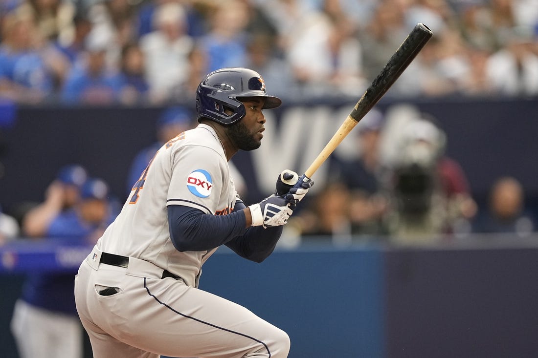 Jun 5, 2023; Toronto, Ontario, CAN; Houston Astros designated hitter Yordan Alvarez (44) hits an RBI single against the Toronto Blue Jays during the first inning at Rogers Centre. Mandatory Credit: John E. Sokolowski-USA TODAY Sports