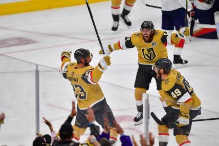 Jun 5, 2023; Las Vegas, Nevada, USA; Vegas Golden Knights defenseman Alec Martinez (23) celebrates a goal with right wing Jonathan Marchessault (81) and center Ivan Barbashev (49) in the first period against the Florida Panthers in game two of the 2023 Stanley Cup Final at T-Mobile Arena. Mandatory Credit: Gary A. Vasquez-USA TODAY Sports