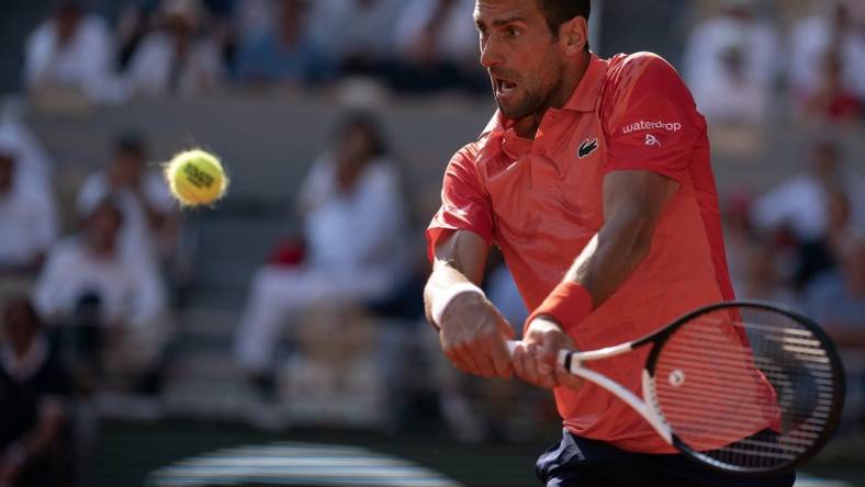 Jun 6 2023; Paris,France; Novak Djokovic (SRB) returns a shot during his match against Karen Khachanov on day 10 at Stade Roland-Garros. Mandatory Credit: Susan Mullane-USA TODAY Sports