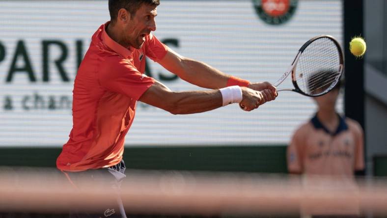 Jun 6 2023; Paris,France; Novak Djokovic (SRB) returns a shot during his match against Karen Khachanov on day 10 at Stade Roland-Garros. Mandatory Credit: Susan Mullane-USA TODAY Sports