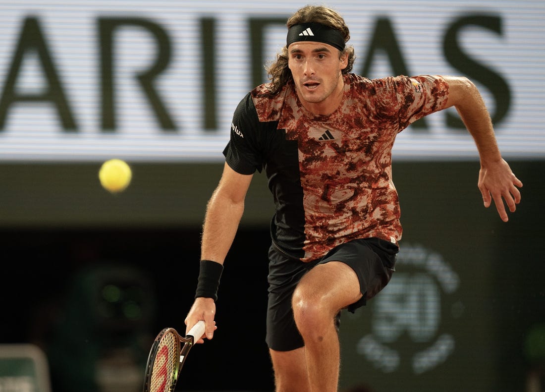 Jun 6 2023; Paris, France; Stefanos Tsitsipas (GRE) runs for the ball during a match against Carlos Alcaraz (ESP) on day 10 at Stade Roland-Garros. Mandatory Credit: Susan Mullane-USA TODAY Sports