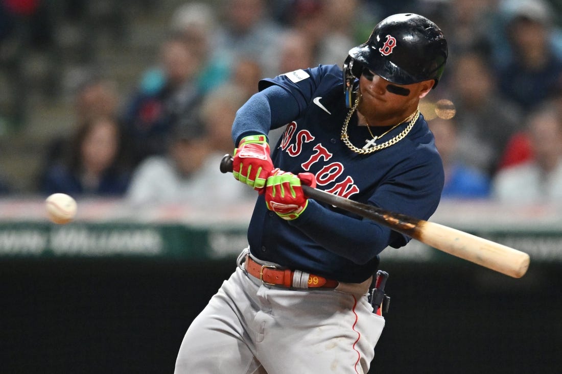 Jun 6, 2023; Cleveland, Ohio, USA; Boston Red Sox right fielder Alex Verdugo (99) hits a sacrifice fly during the eighth inning against the Cleveland Guardians at Progressive Field. Mandatory Credit: Ken Blaze-USA TODAY Sports