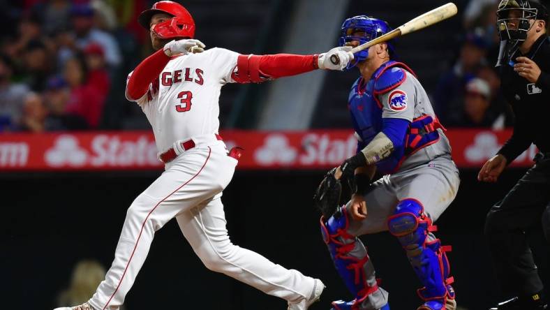 Jun 6, 2023; Anaheim, California, USA; Los Angeles Angels left fielder Taylor Ward (3) hits a solo home run against the Chicago Cubs during the seventh inning at Angel Stadium. Mandatory Credit: Gary A. Vasquez-USA TODAY Sports