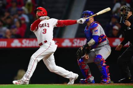 Jun 6, 2023; Anaheim, California, USA; Los Angeles Angels left fielder Taylor Ward (3) hits a solo home run against the Chicago Cubs during the seventh inning at Angel Stadium. Mandatory Credit: Gary A. Vasquez-USA TODAY Sports