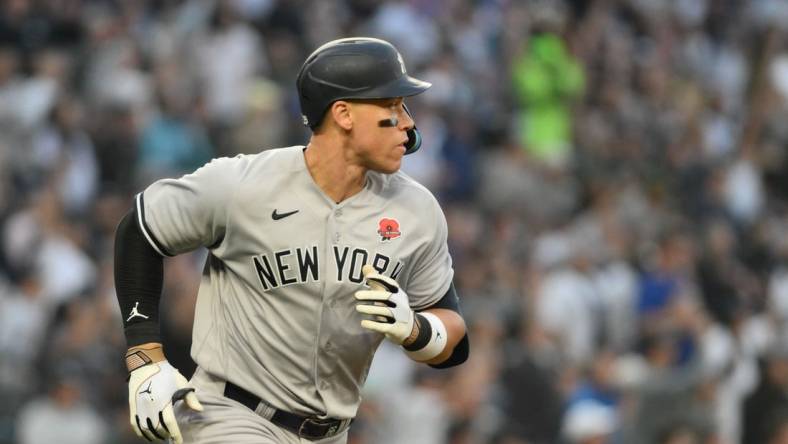 May 29, 2023; Seattle, Washington, USA; New York Yankees right fielder Aaron Judge (99) runs towards first base after hitting the ball against the Seattle Mariners at T-Mobile Park. Mandatory Credit: Steven Bisig-USA TODAY Sports