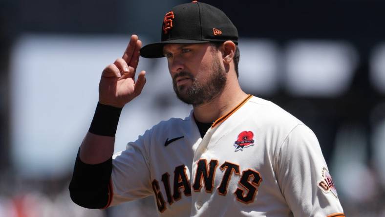 May 29, 2023; San Francisco, California, USA; San Francisco Giants third baseman J.D. Davis (7) gestures before the game against the Pittsburgh Pirates at Oracle Park. Mandatory Credit: Darren Yamashita-USA TODAY Sports