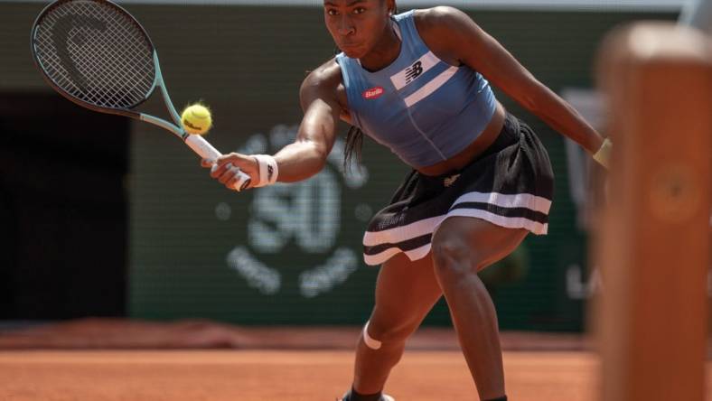 Jun 7 2023; Paris,France; Coco Gauff (USA) returns a shot during her match against Iga Swiatek (POL) on day 11 at Stade Roland-Garros. Mandatory Credit: Susan Mullane-USA TODAY Sports