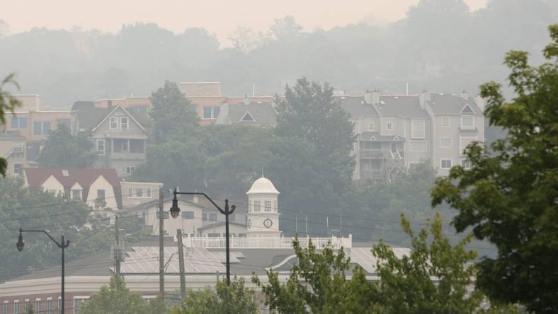 A smoky haze surrounds Tarrytown Village Hall and nearby residences June 7, 2023. The state Department of Environmental Conservation issued air quality advisories for most of New York due to smoke from wildfires in Canada.