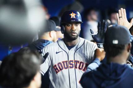 Jun 7, 2023; Toronto, Ontario, CAN; Houston Astros designated hitter Yordan Alvarez (44) celebrates in the dugout after hitting a two run home run against the Toronto Blue Jays during the fourth inning at Rogers Centre. Mandatory Credit: Nick Turchiaro-USA TODAY Sports