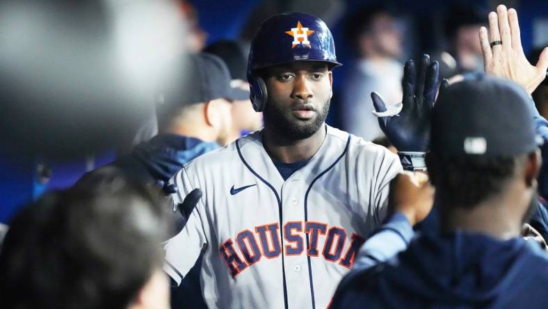 Jun 7, 2023; Toronto, Ontario, CAN; Houston Astros designated hitter Yordan Alvarez (44) celebrates in the dugout after hitting a two run home run against the Toronto Blue Jays during the fourth inning at Rogers Centre. Mandatory Credit: Nick Turchiaro-USA TODAY Sports