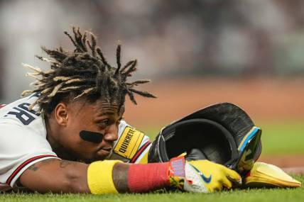 Jun 7, 2023; Cumberland, Georgia, USA; Atlanta Braves right fielder Ronald Acuna Jr. (13) shown after stealing third base against the New York Mets during the eighth inning at Truist Park. Mandatory Credit: Dale Zanine-USA TODAY Sports