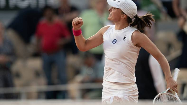 Jun 8 2023; Paris,France; Iga Swiatek (POL) celebrates winning her semi final match agains Beatriz Haddad Maia (BRA) on day 12 at Stade Roland-Garros. Mandatory Credit: Susan Mullane-USA TODAY Sports