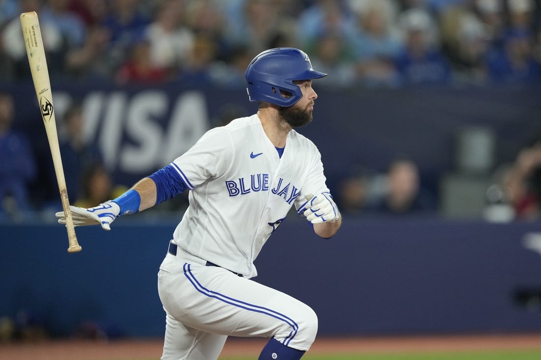 Jun 8, 2023; Toronto, Ontario, CAN; Toronto Blue Jays designated hitter Brandon Belt (13) hits an RBI single against the Houston Astros during the fifth inning at Rogers Centre. Mandatory Credit: John E. Sokolowski-USA TODAY Sports