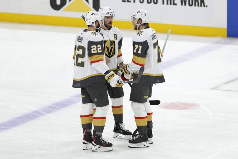 Jun 8, 2023; Sunrise, Florida, USA; Vegas Golden Knights right wing Michael Amadio (22), right wing Reilly Smith (19), and center William Karlsson (71) speak during a timeout during the third period against the Florida Panthers in game three of the 2023 Stanley Cup Final at FLA Live Arena. Mandatory Credit: Sam Navarro-USA TODAY Sports