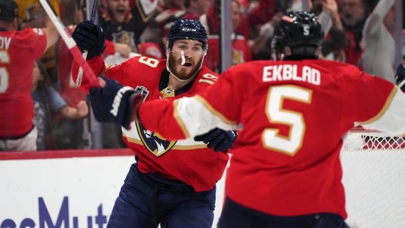 Jun 8, 2023; Sunrise, Florida, USA; (Editors Notes: Caption Correction) Florida Panthers left wing Matthew Tkachuk (19) and defenseman Aaron Ekblad (5) celebrate the game winning goal scored by defenseman Brandon Montour (not pictured) against the Vegas Golden Knights Florida Panthers during overtime in game three of the 2023 Stanley Cup Final at FLA Live Arena. Mandatory Credit: Jasen Vinlove-USA TODAY Sports