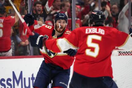 Jun 8, 2023; Sunrise, Florida, USA; (Editors Notes: Caption Correction) Florida Panthers left wing Matthew Tkachuk (19) and defenseman Aaron Ekblad (5) celebrate the game winning goal scored by defenseman Brandon Montour (not pictured) against the Vegas Golden Knights Florida Panthers during overtime in game three of the 2023 Stanley Cup Final at FLA Live Arena. Mandatory Credit: Jasen Vinlove-USA TODAY Sports
