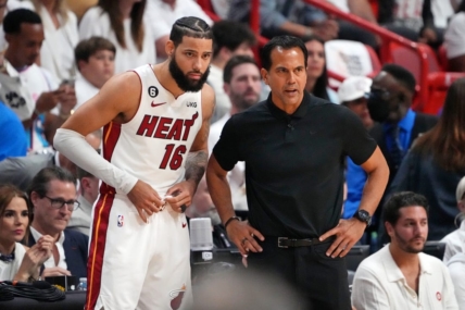 Jun 9, 2023; Miami, Florida, USA; Miami Heat forward Caleb Martin (16) talks with head coach Erik Spoelstra during a pause in play against the Denver Nuggets during the first quarter in game four of the 2023 NBA Finals at Kaseya Center. Mandatory Credit: Kyle Terada-USA TODAY Sports