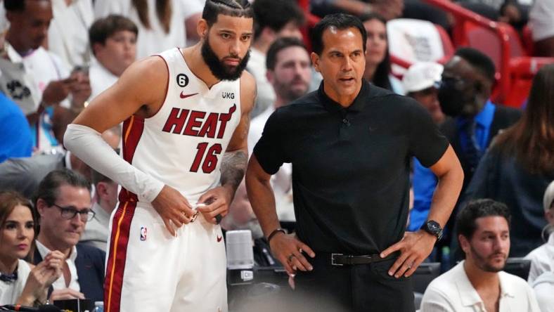 Jun 9, 2023; Miami, Florida, USA; Miami Heat forward Caleb Martin (16) talks with head coach Erik Spoelstra during a pause in play against the Denver Nuggets during the first quarter in game four of the 2023 NBA Finals at Kaseya Center. Mandatory Credit: Kyle Terada-USA TODAY Sports