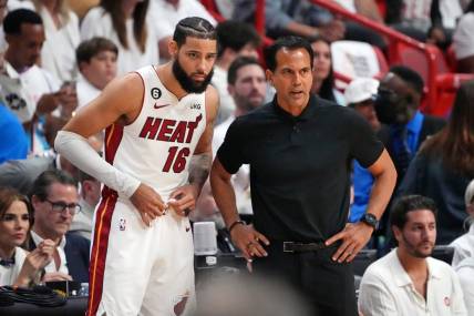 Jun 9, 2023; Miami, Florida, USA; Miami Heat forward Caleb Martin (16) talks with head coach Erik Spoelstra during a pause in play against the Denver Nuggets during the first quarter in game four of the 2023 NBA Finals at Kaseya Center. Mandatory Credit: Kyle Terada-USA TODAY Sports