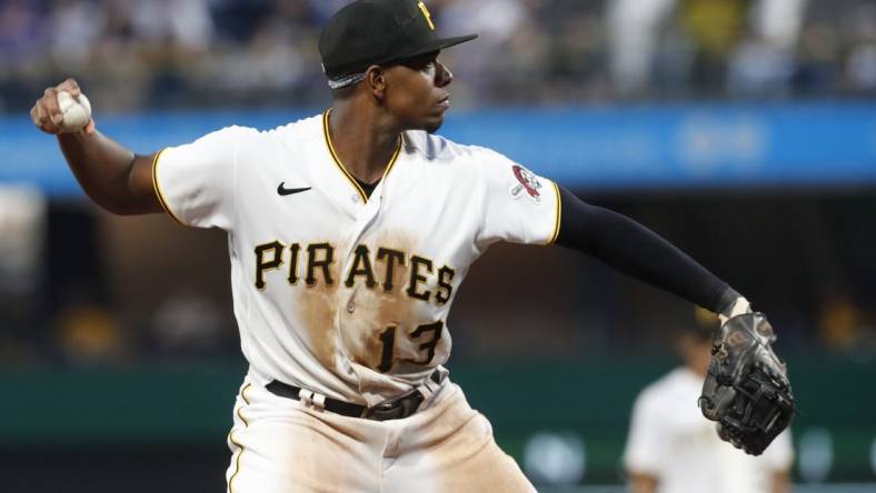 Jun 9, 2023; Pittsburgh, Pennsylvania, USA;  Pittsburgh Pirates third baseman Ke'Bryan Hayes (13) throws to first base to retire New York Mets first baseman Mark Canha (not pictured) during the sixth inning at PNC Park. Mandatory Credit: Charles LeClaire-USA TODAY Sports