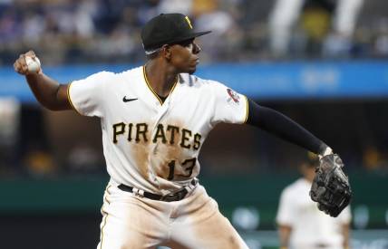 Jun 9, 2023; Pittsburgh, Pennsylvania, USA;  Pittsburgh Pirates third baseman Ke'Bryan Hayes (13) throws to first base to retire New York Mets first baseman Mark Canha (not pictured) during the sixth inning at PNC Park. Mandatory Credit: Charles LeClaire-USA TODAY Sports
