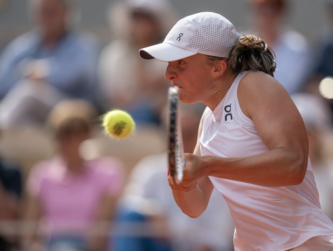 Jun 10, 2023; Paris,France; Iga Swiatek (POL) returns a shot during the French Open final against Karolina Muchova (CZE) on day 14 at Stade Roland-Garros. Mandatory Credit: Susan Mullane-USA TODAY Sports