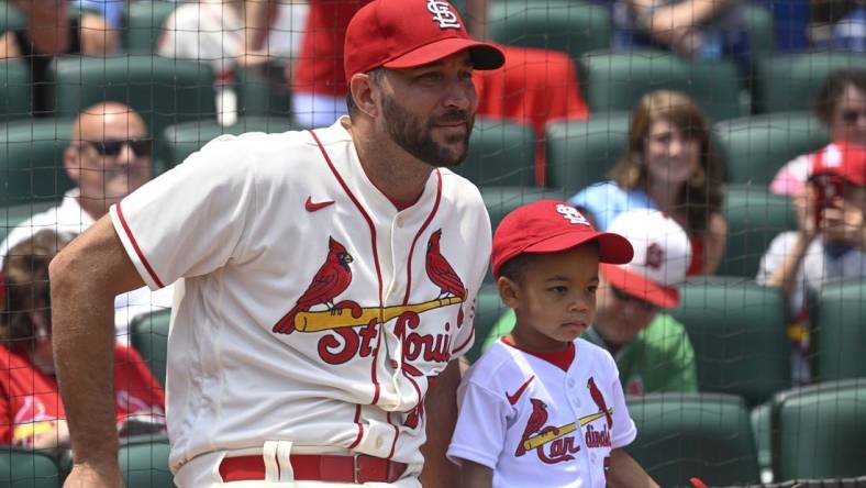 Jun 10, 2023; St. Louis, Missouri, USA; St. Louis Cardinals starting pitcher Adam Wainwright (50) and his son Caleb look on prior to a ceremonial first pitch before a game against the Cincinnati Reds at Busch Stadium. Mandatory Credit: Joe Puetz-USA TODAY Sports
