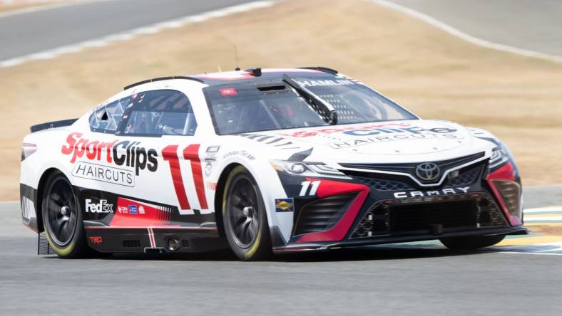 Jun 10, 2023; Sonoma, California, USA; NASCAR Cup Series driver Denny Hamlin (11) performs a practice lap before qualifications at Sonoma Raceway. Mandatory Credit: Stan Szeto-USA TODAY Sports